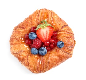 Fresh delicious puff pastry with sweet berries on white background, top view