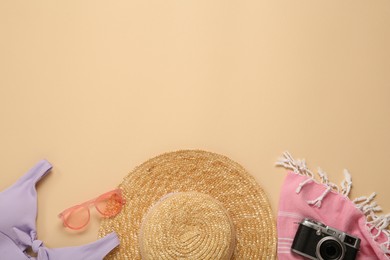 Photo of Flat lay composition with straw hat on beige background. Space for text