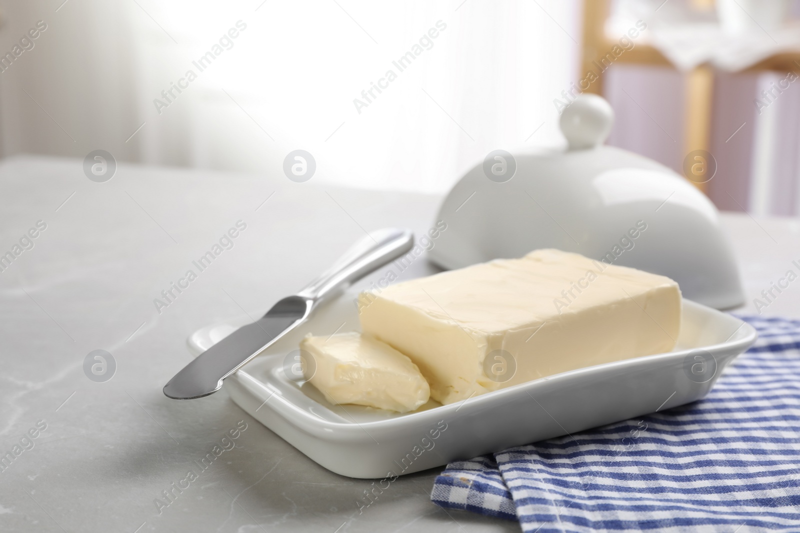 Photo of Dish with tasty fresh butter on table