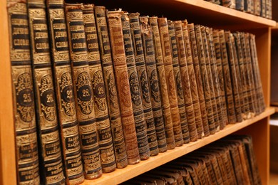 Collection of old books on shelf in library