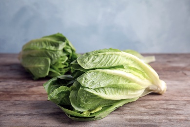 Photo of Fresh ripe cos lettuce on wooden table