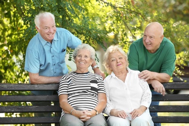 Photo of Elderly people spending time together in park