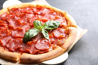 Tasty pepperoni pizza on dark grey table, closeup. Space for text