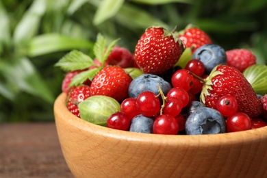 Mix of ripe berries in bowl, closeup