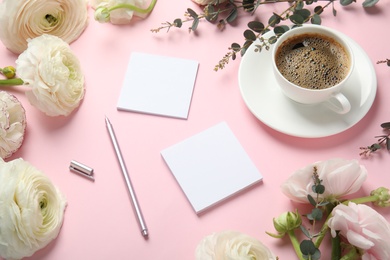 Composition with spring ranunculus flowers and cards on color background. Space for text