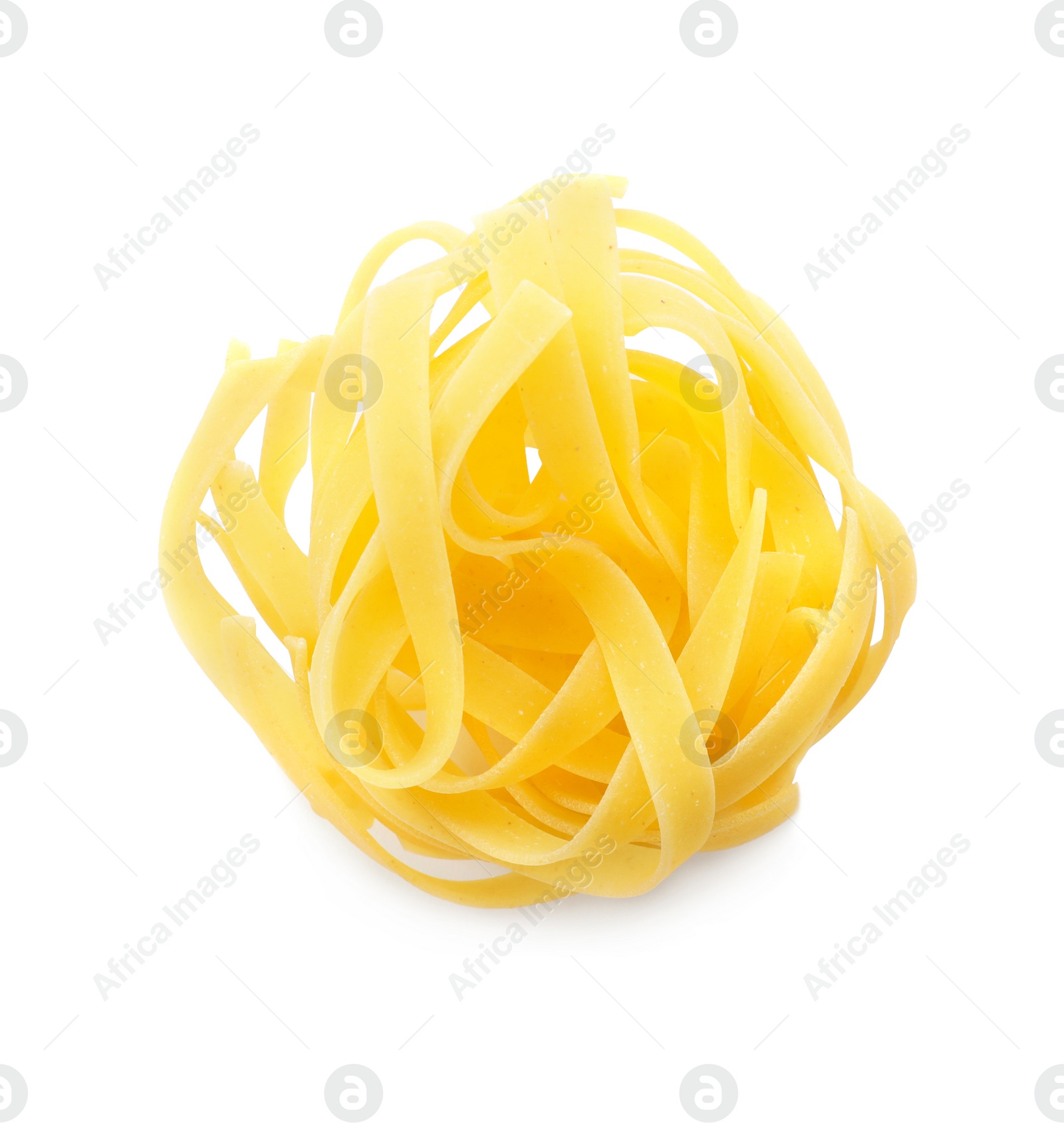 Photo of Uncooked fettuccine pasta on white background, top view