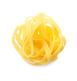 Photo of Uncooked fettuccine pasta on white background, top view