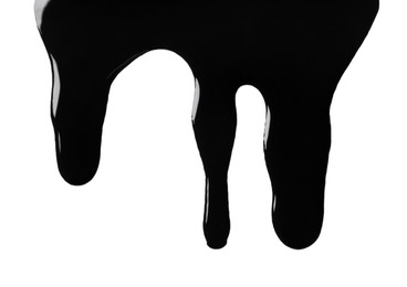 Photo of Black glossy oil flowing on white background