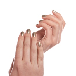 Woman showing gold manicure isolated on white, closeup. Nail polish trends