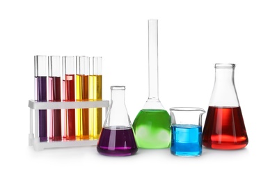 Photo of Laboratory glassware with color liquids on white background