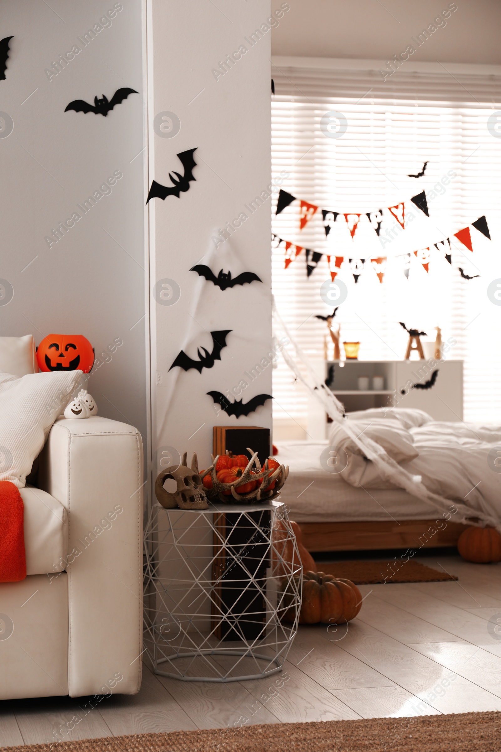 Photo of Stylish room interior with creative Halloween decor