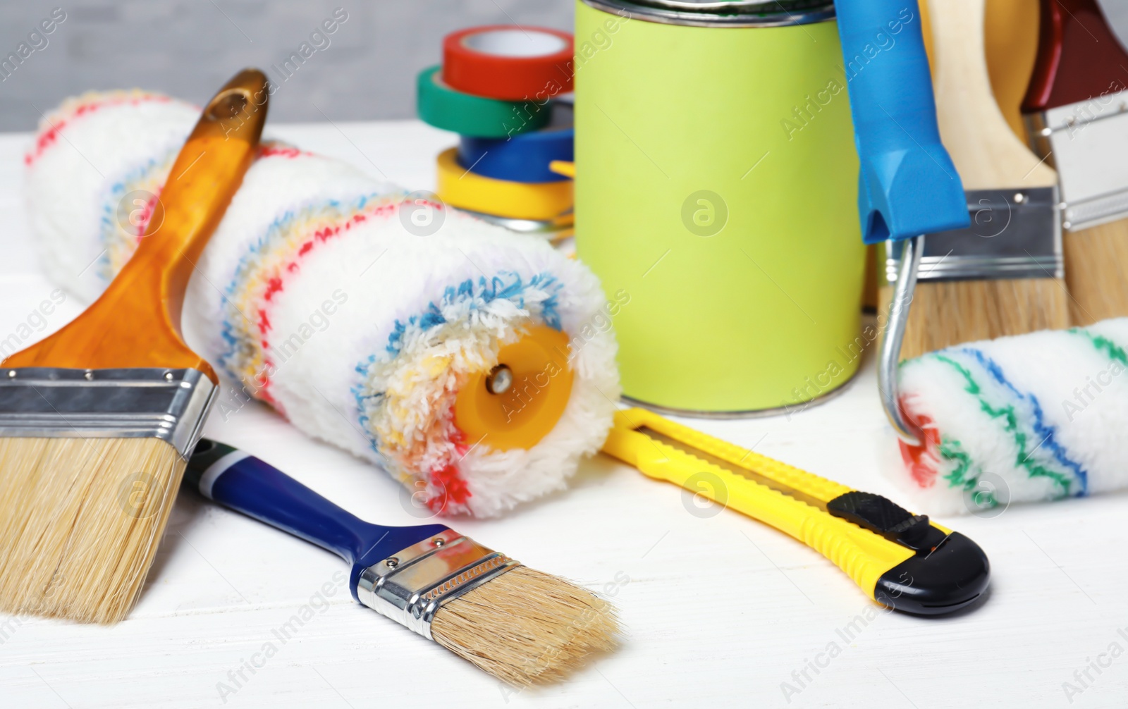 Photo of Set of decorator's tools on wooden table