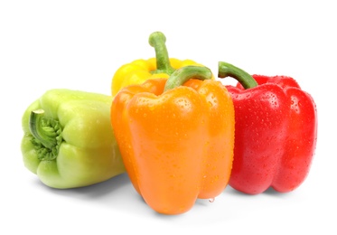 Wet ripe bell peppers on white background