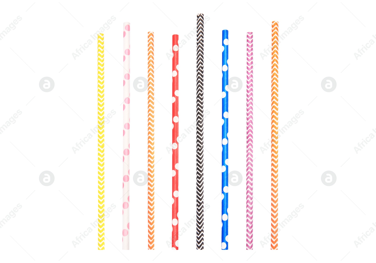 Image of Set of striped and dotted paper drinking straws on white background