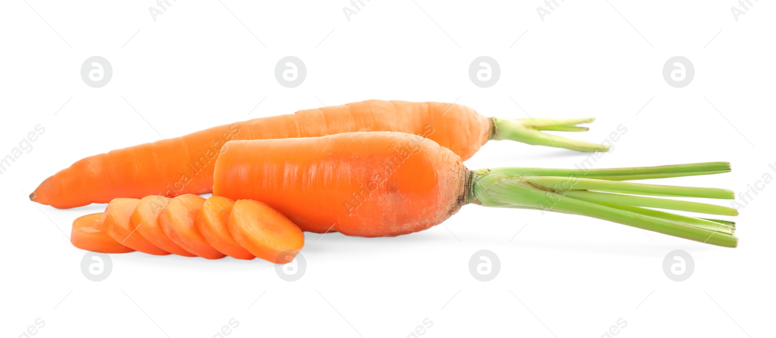 Whole and sliced ripe carrots isolated on white Photo of Whole and sliced ripe carrots isolated on white