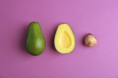 Photo of Flat lay composition with ripe avocados on color background