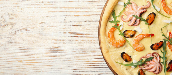 Image of Top view of hot delicious pizza on white wooden table, space for text. Banner design 