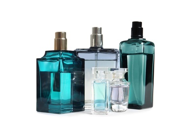 Photo of Different perfume bottles on white background