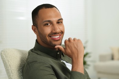 Photo of Portrait of handsome young man at home