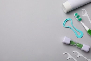 Photo of Flat lay composition with tongue cleaner on color background, space for text
