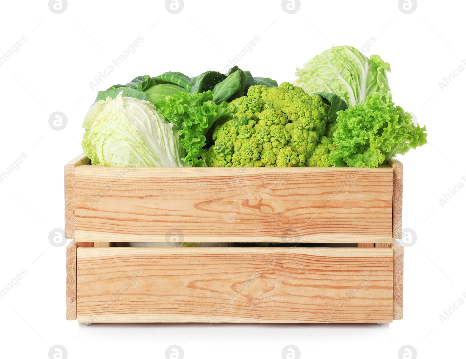 Wooden crate full of fresh green vegetables on white background Photo of Wooden crate full of fresh green vegetables on white background