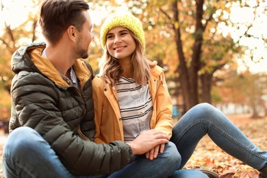 Photo of Lovely couple spending time together in park. Autumn walk