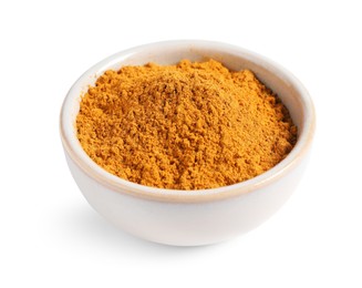 Photo of Curry powder in bowl isolated on white