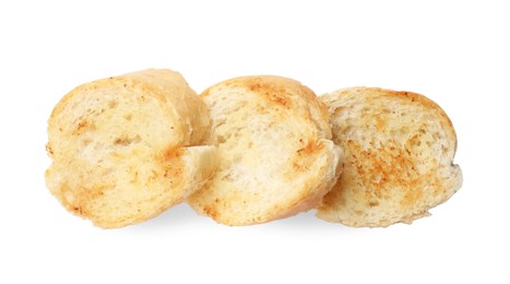 Photo of Pieces of toasted bread isolated on white, top view