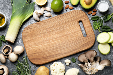 Photo of Flat lay composition with fresh products on grey table, space for text. Healthy cooking