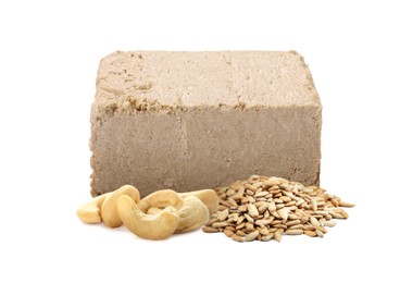 Image of Tasty halva, peeled sunflower seeds and cashew nuts isolated on white