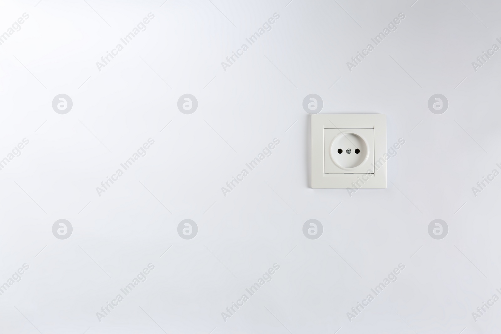 Photo of Power socket on white background. Electrician's equipment