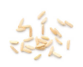 Photo of Scattered grains of brown rice on white background, top view