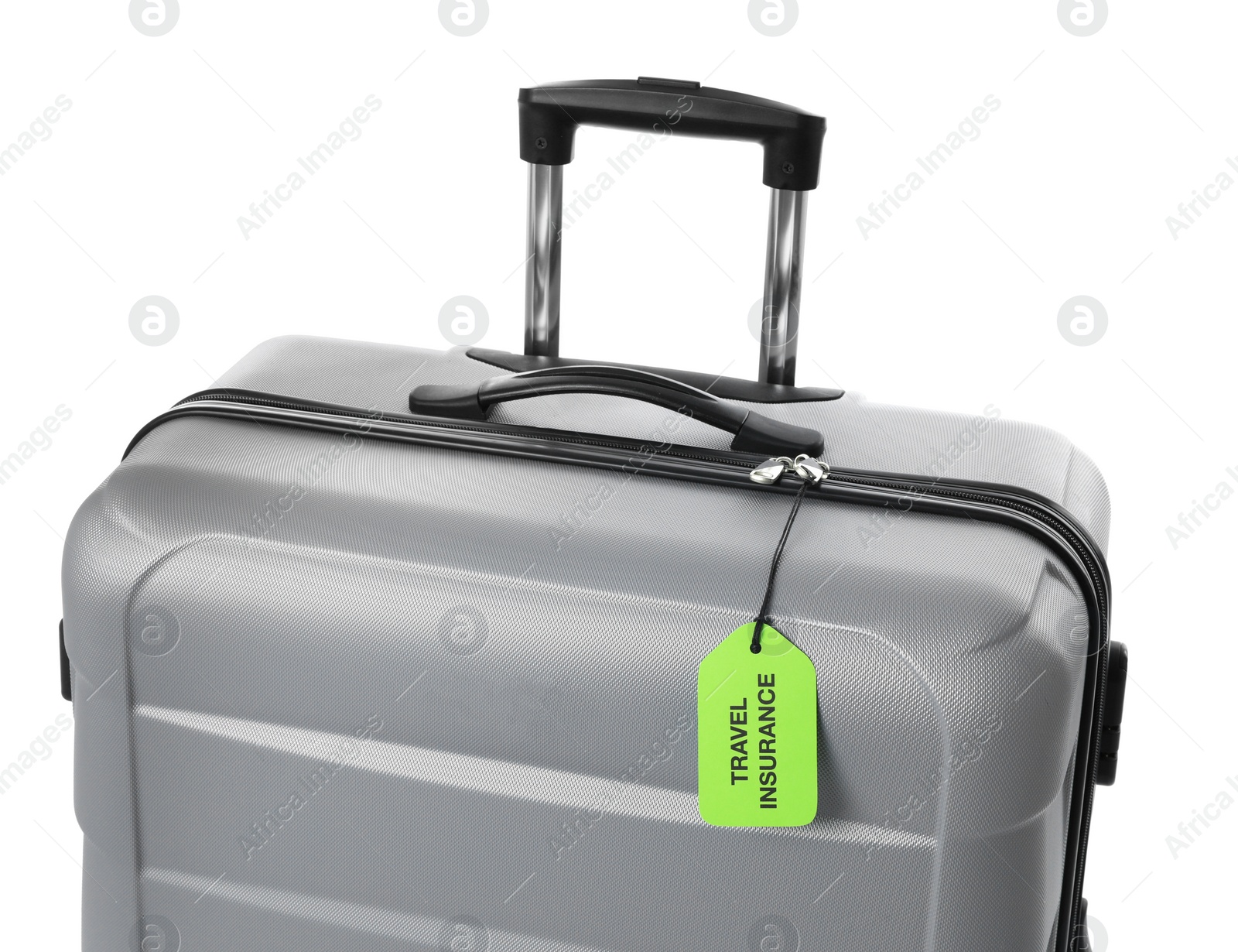 Photo of Grey suitcase with TRAVEL INSURANCE label on white background, closeup