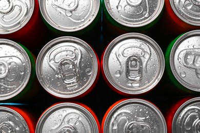 Energy drinks in wet cans, top view. Functional beverage