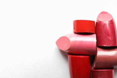 Photo of Different lipstick swatches on white background, top view