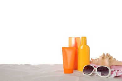 Composition with sun protection products on sand against white background. Space for text