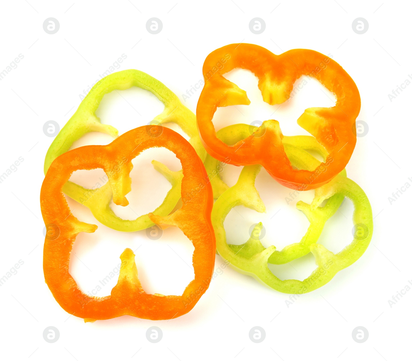 Photo of Rings of ripe bell peppers on white background, top view