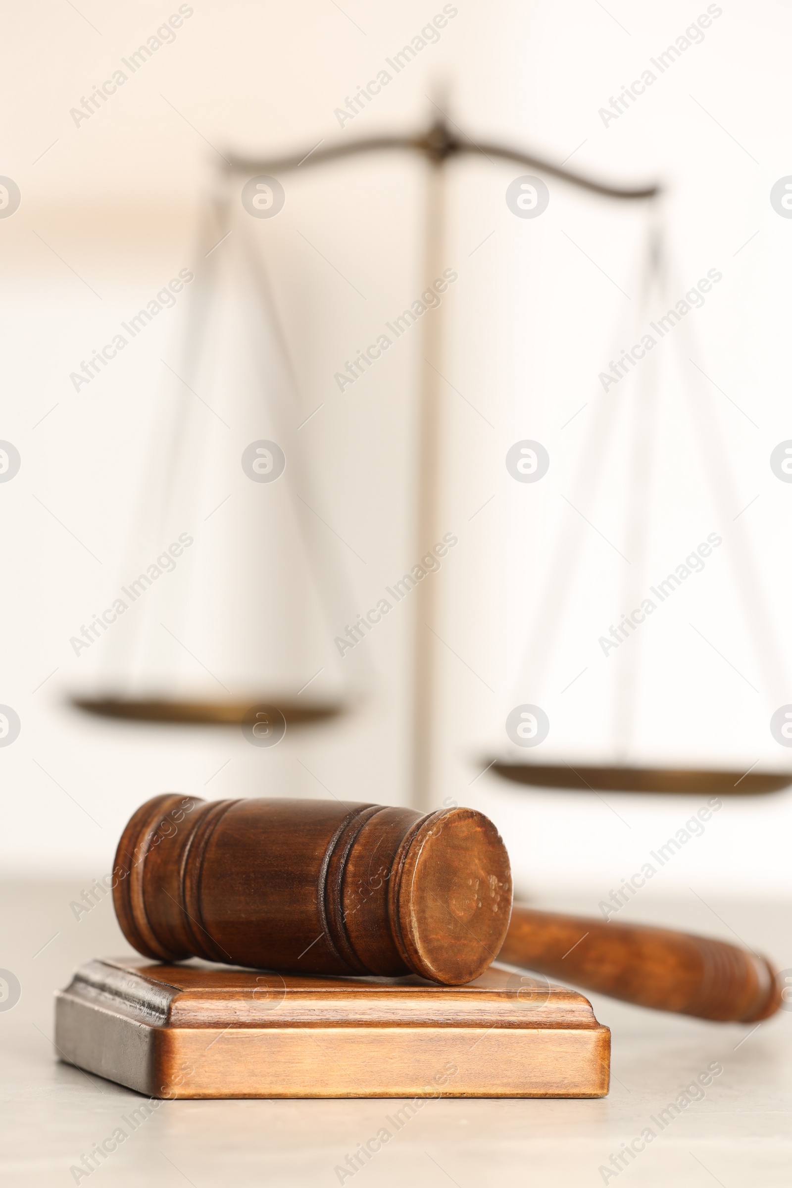 Photo of Law concept. Gavel and sound block on white table