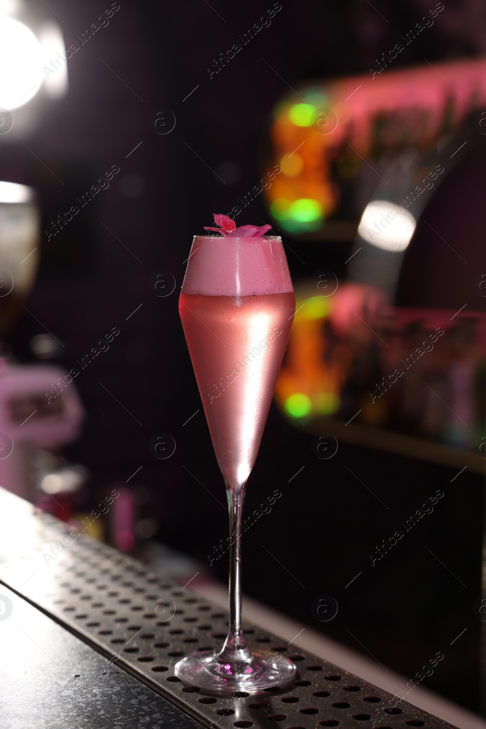 Photo of Fresh alcoholic cocktail on counter in bar