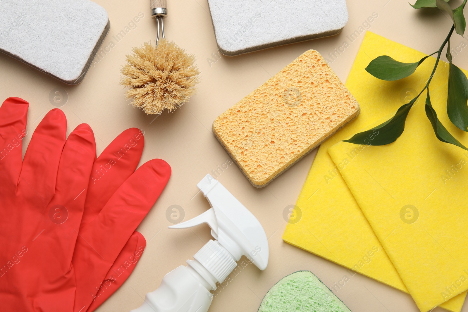 Photo of Flat lay composition with sponges and other cleaning supplies on beige background
