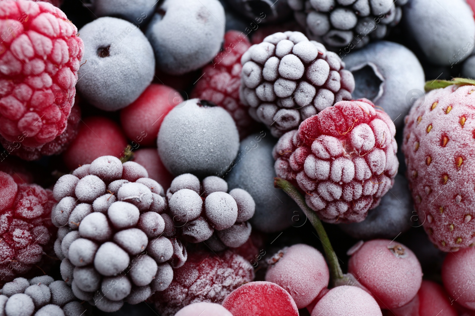 Photo of Mix of different frozen berries as background, closeup