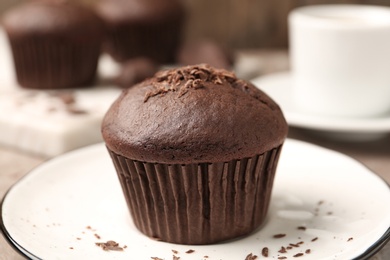 Delicious cupcake with chocolate crumbles on plate, closeup