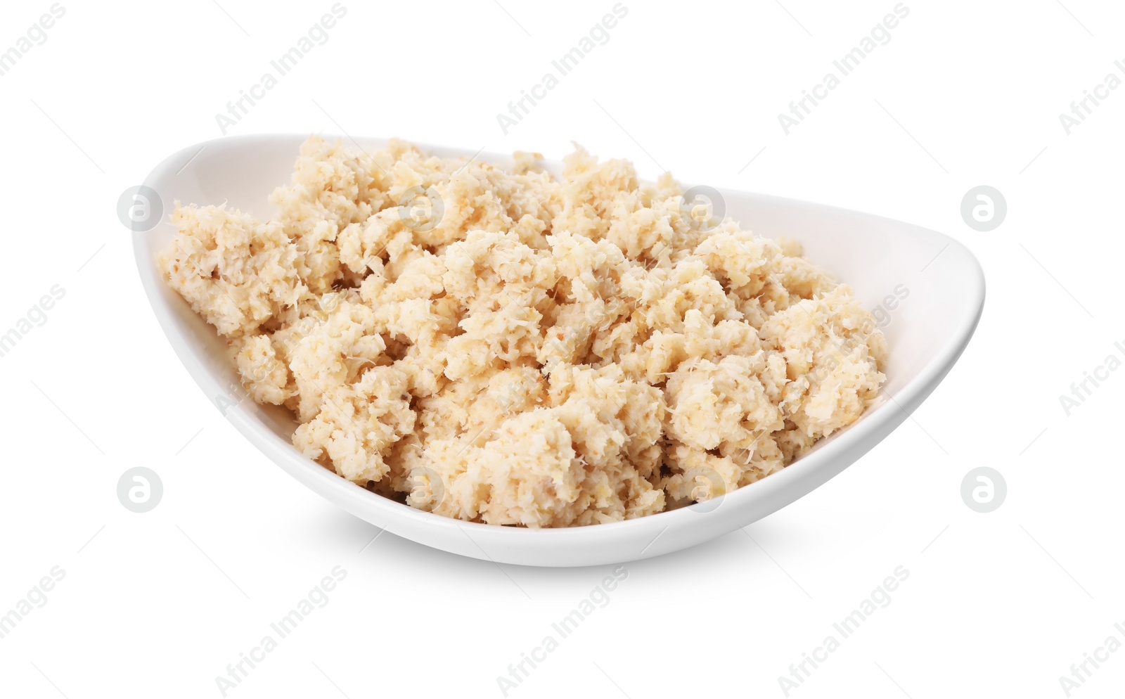 Photo of Bowl of tasty prepared horseradish isolated on white