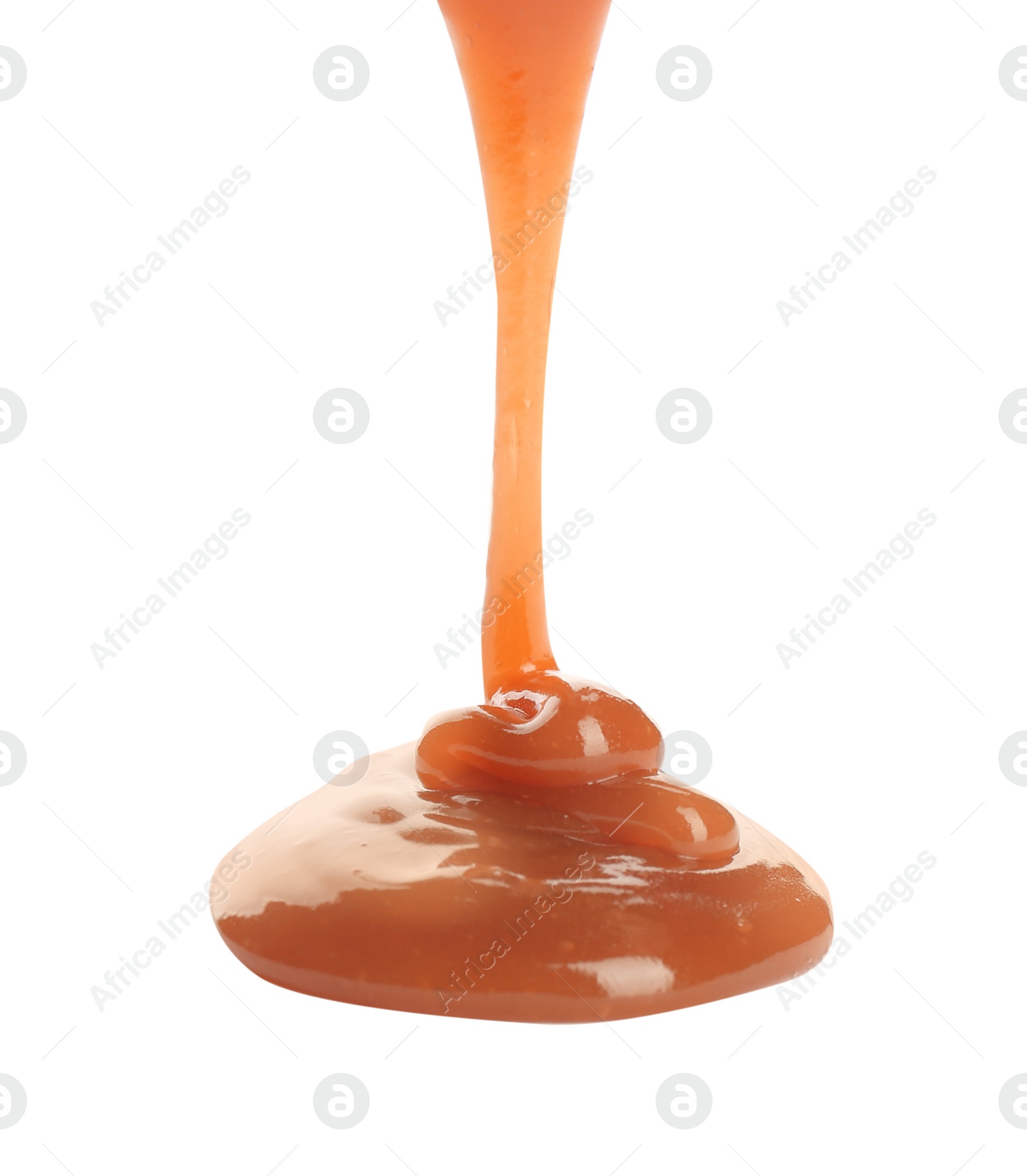 Photo of Pouring sweet caramel sauce on white background