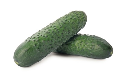 Photo of Whole fresh green cucumbers on white background