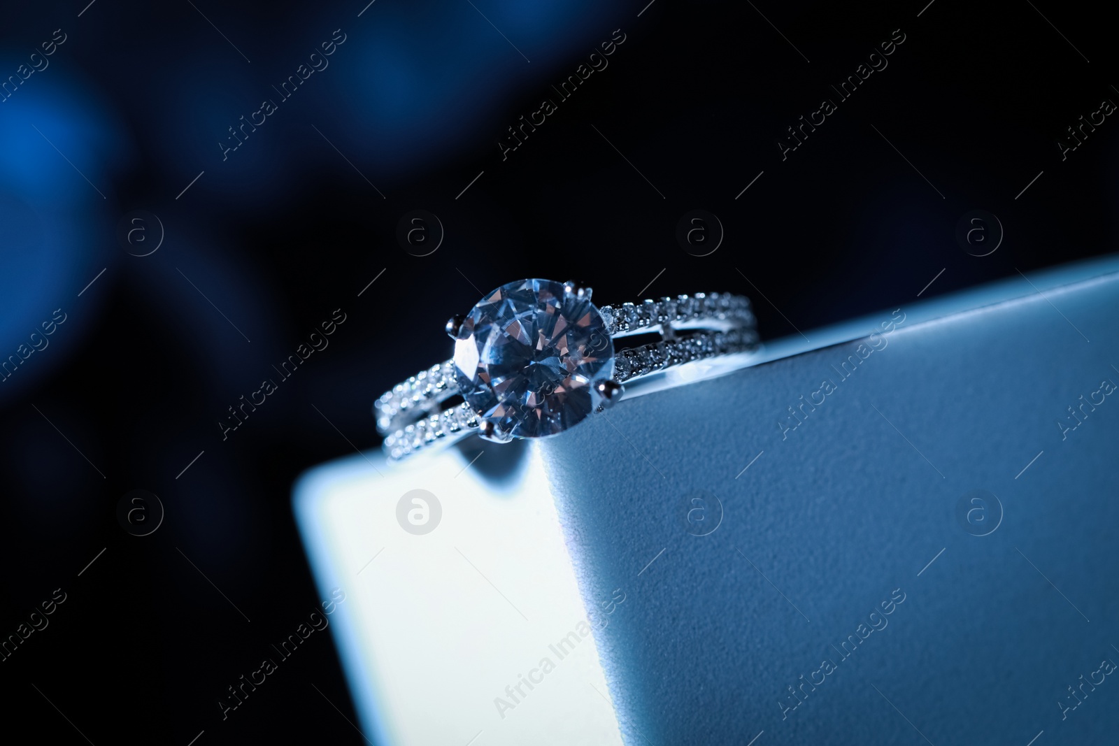 Photo of Elegant jewelry. Stylish presentation of luxury ring on podium, closeup