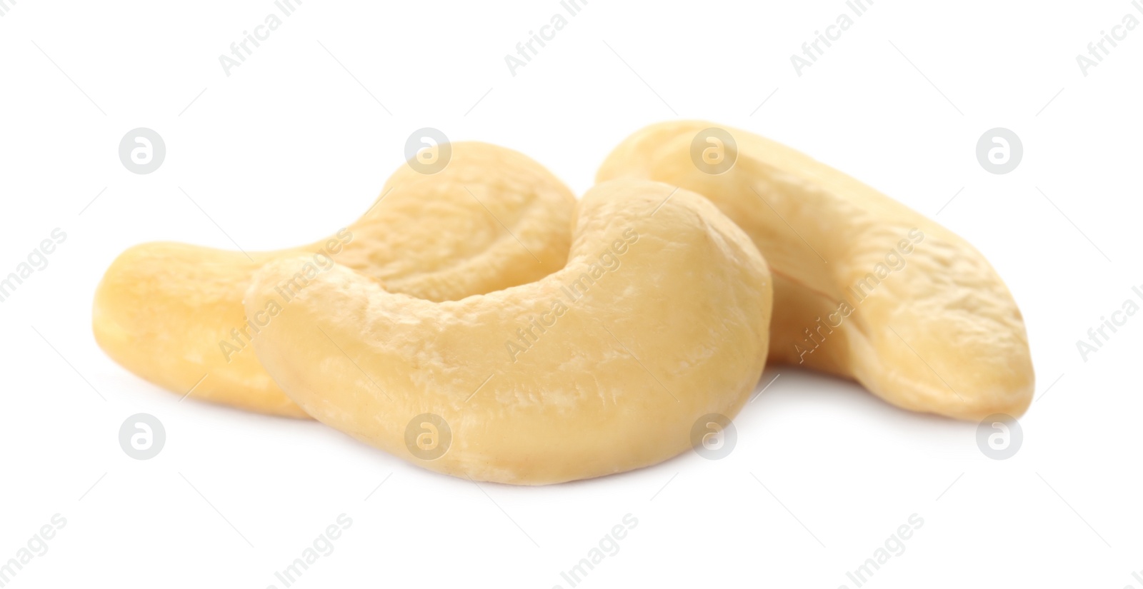 Photo of Pile of tasty organic cashew nuts isolated on white