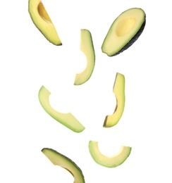 Image of Falling fresh ripe avocados on white background