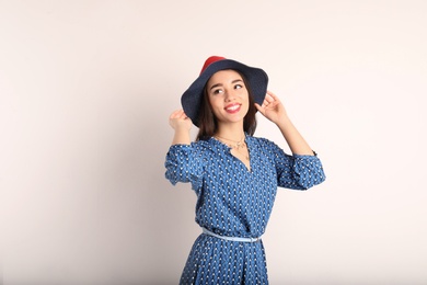 Photo of Portrait of beautiful young woman in stylish dress on white background