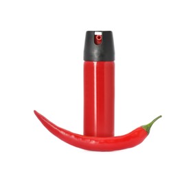 Bottle of gas spray and fresh chili pepper on white background